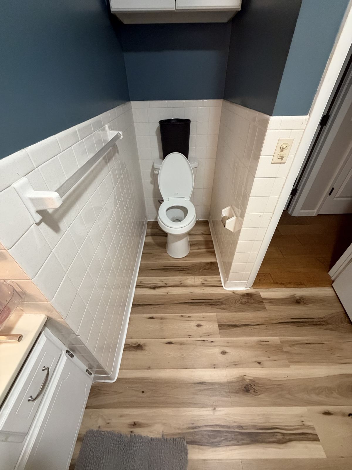 New vinyl plank floor in a toilet alcove